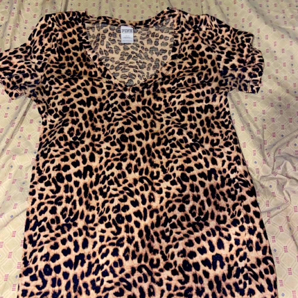 Pink small v neck shirt.